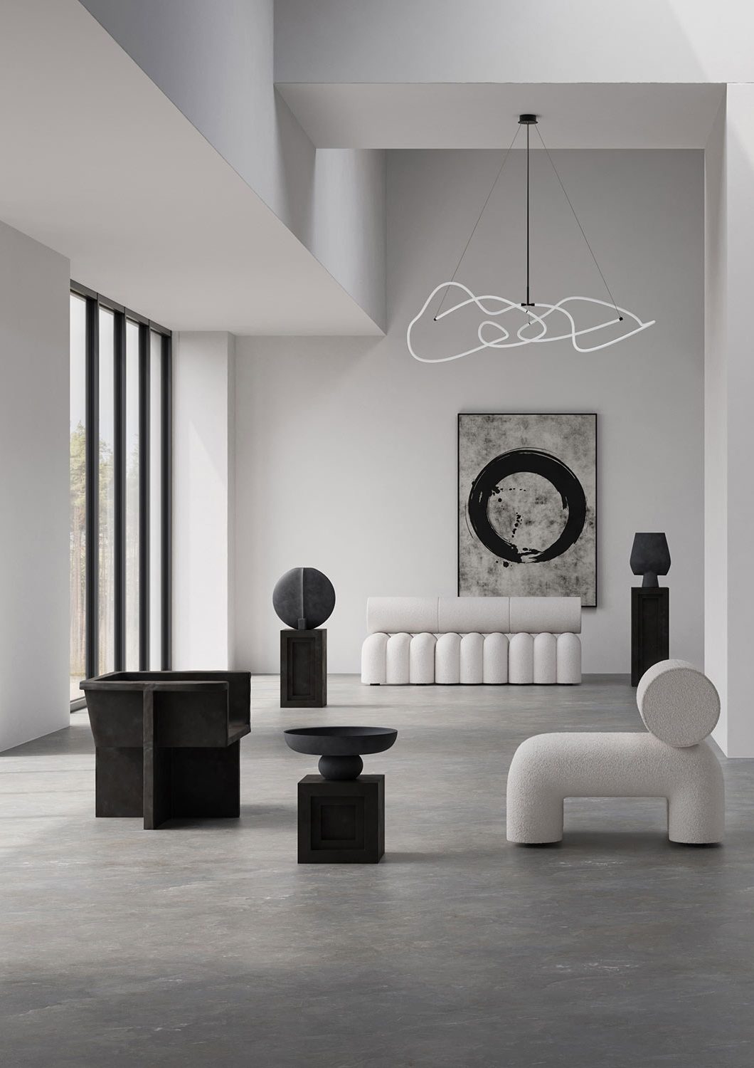 Minimalistic lounge with 2 chairs and contemporary pendant light and modern couch in background - all monochrome black and white with concrete